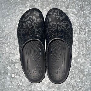 Crocs black with Silver floral print clogs